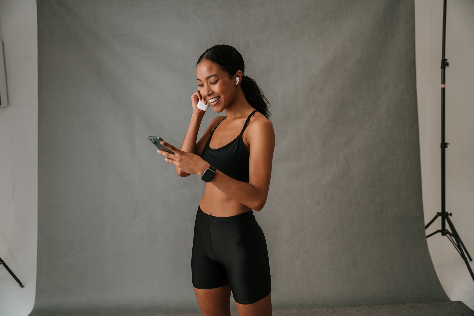 Young female African American on her cellphone in the studio